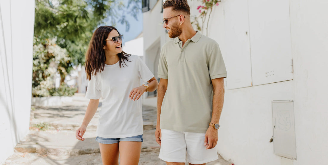 a couple laughing while wearing forest wooden watches in the sun