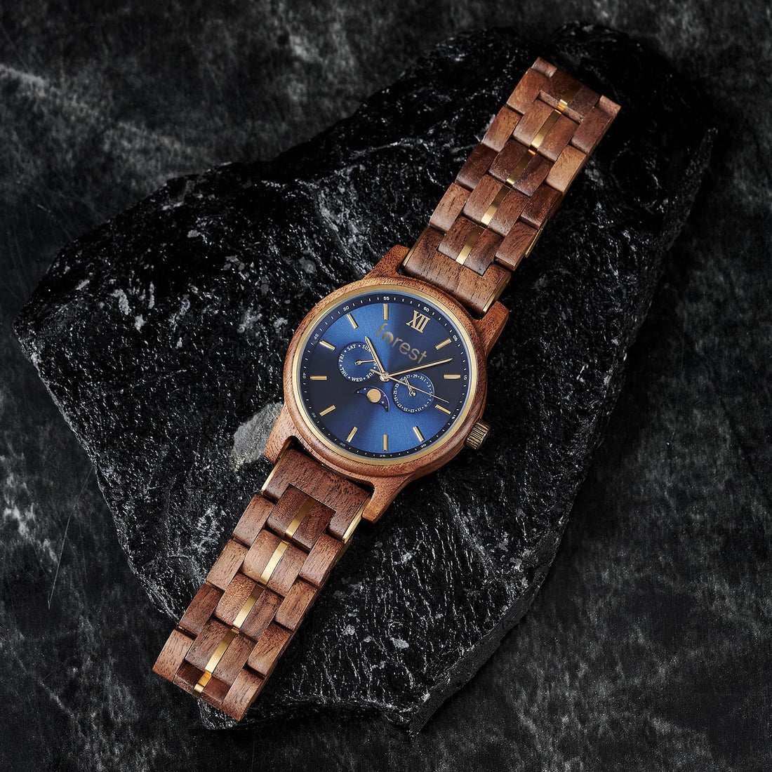 Windsor wooden watch on its side, resting on a rock
