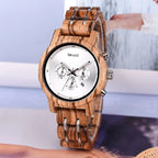 EMBER women's wooden watch displayed beside a magazine