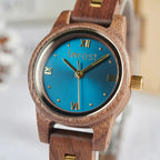 Blue dial Midnight wooden watch, close view of the blue dial and gold hands