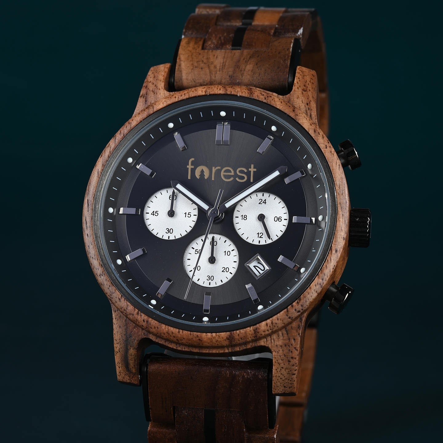 Woodland wooden watch at a three quarter angle, close view of the dial and crown