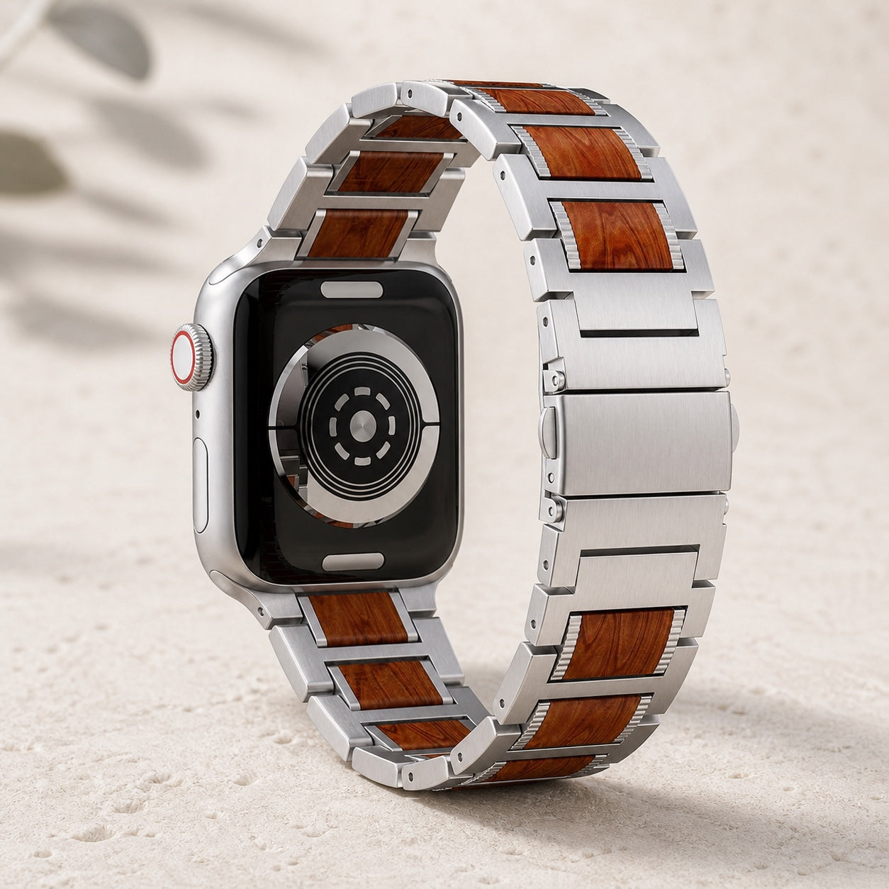 Wood and stainless-steel Apple Watch strap showing the rear sensor and butterfly clasp