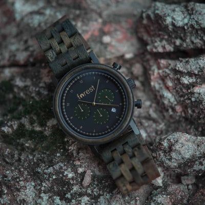 forest hunter watch made from wood on its side on a rock