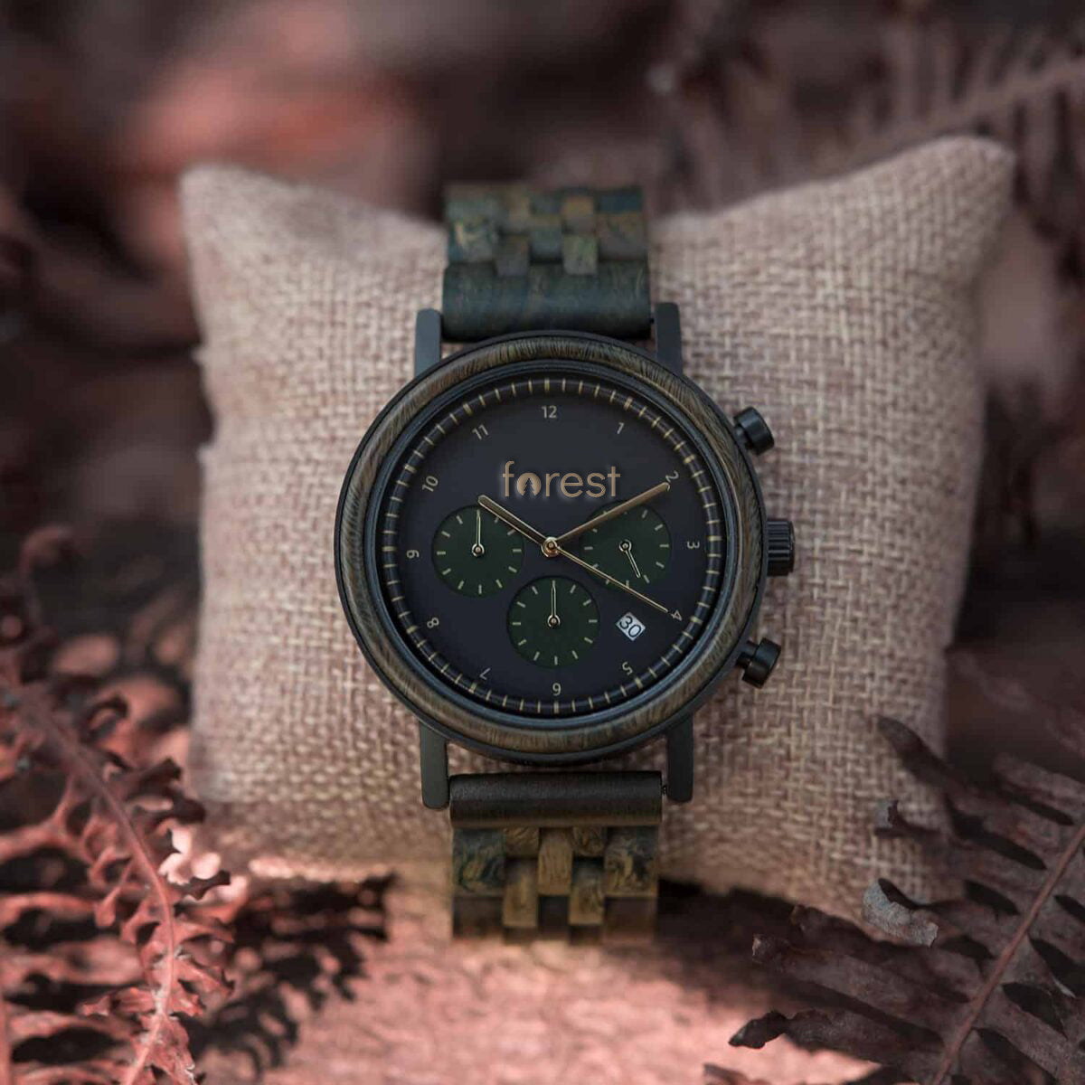 Hunter wooden watch on a watch pillow