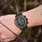 A close up of a model wrist wearing Mens Wooden Hunter Watch by Forest