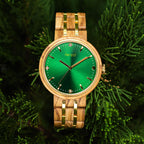 Forest Ivy watch made from olivewood hanging from a tree branch