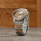 Barrel whiskey wood watch displayed from a unique angle on concrete table top