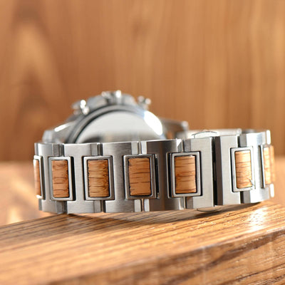 Back view of Barrel whiskey wood watch for men on a wooden table