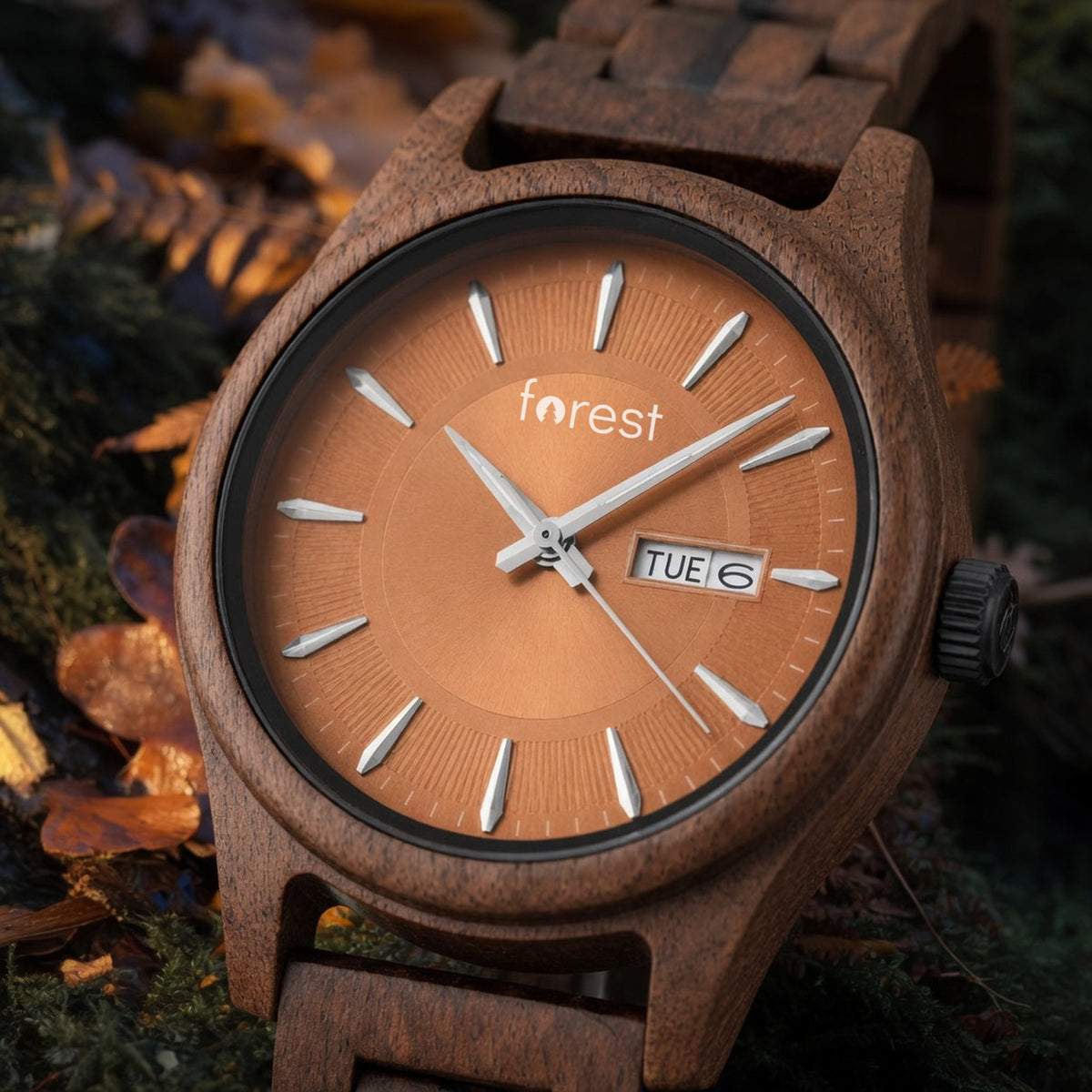 Bracken walnut watch with copper dial, close view of the dial on an autumn woodland floor with bracken