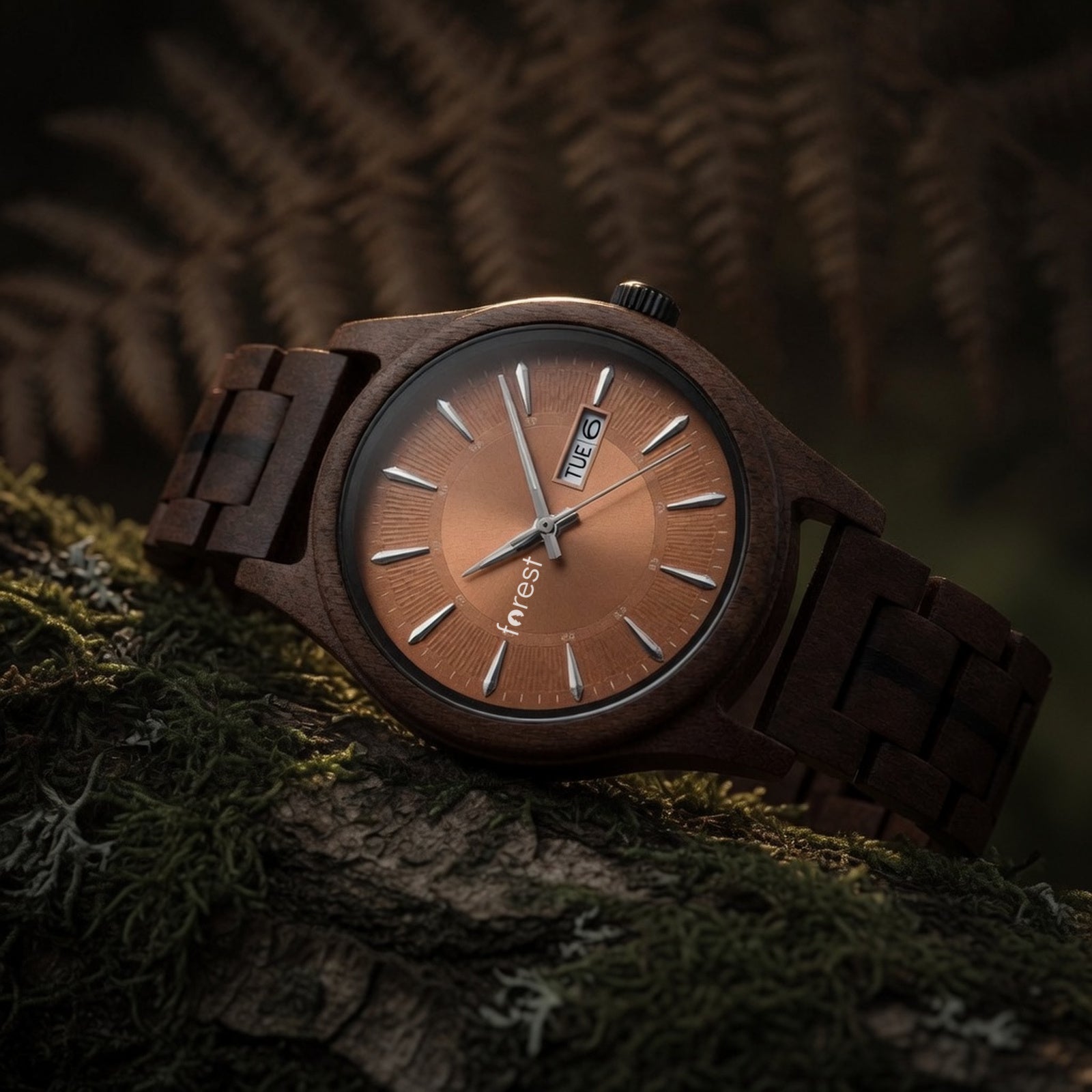 Bracken walnut watch with copper dial, low view on an autumn woodland floor with bracken, leaning back