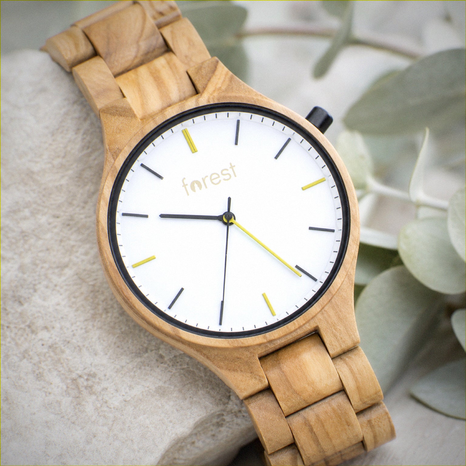 Dawn wooden watch, close view of the white dial and greeny yellow markers