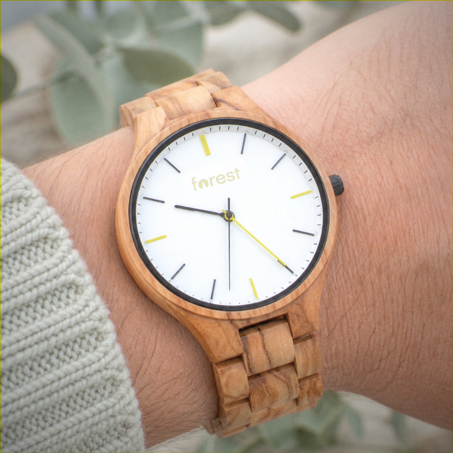 Dawn wooden watch worn on the wrist in daylight