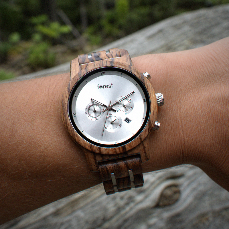 EMBER women's wooden watch worn on a wrist outdoors