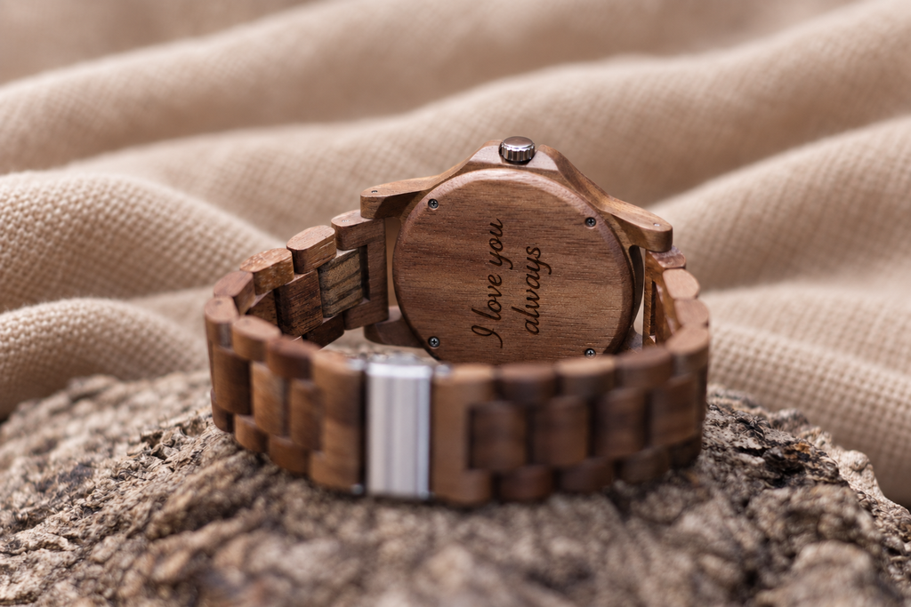 Windsor wooden caseback with four screws and an example message engraved in script