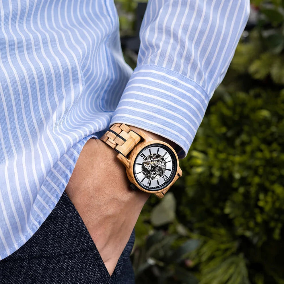 Black accent WOODHAVEN wooden watch worn on the wrist with a striped shirt