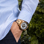 Black accent WOODHAVEN wooden watch worn on the wrist with a striped shirt