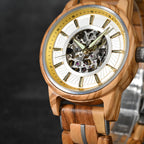 Gold/silver accent WOODHAVEN wooden watch, close view of the yellow inner ring and silver band links