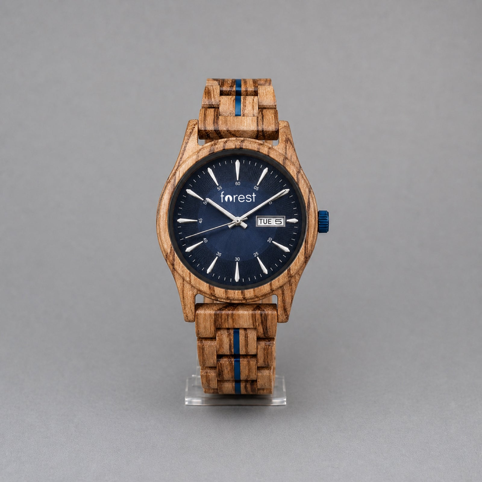 Harbour men's zebrawood watch with navy dial, upright on a studio stand