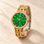 Complete Ivy watch at a three-quarter angle on warm ivory stone, with its bracelet and silver clasp visible