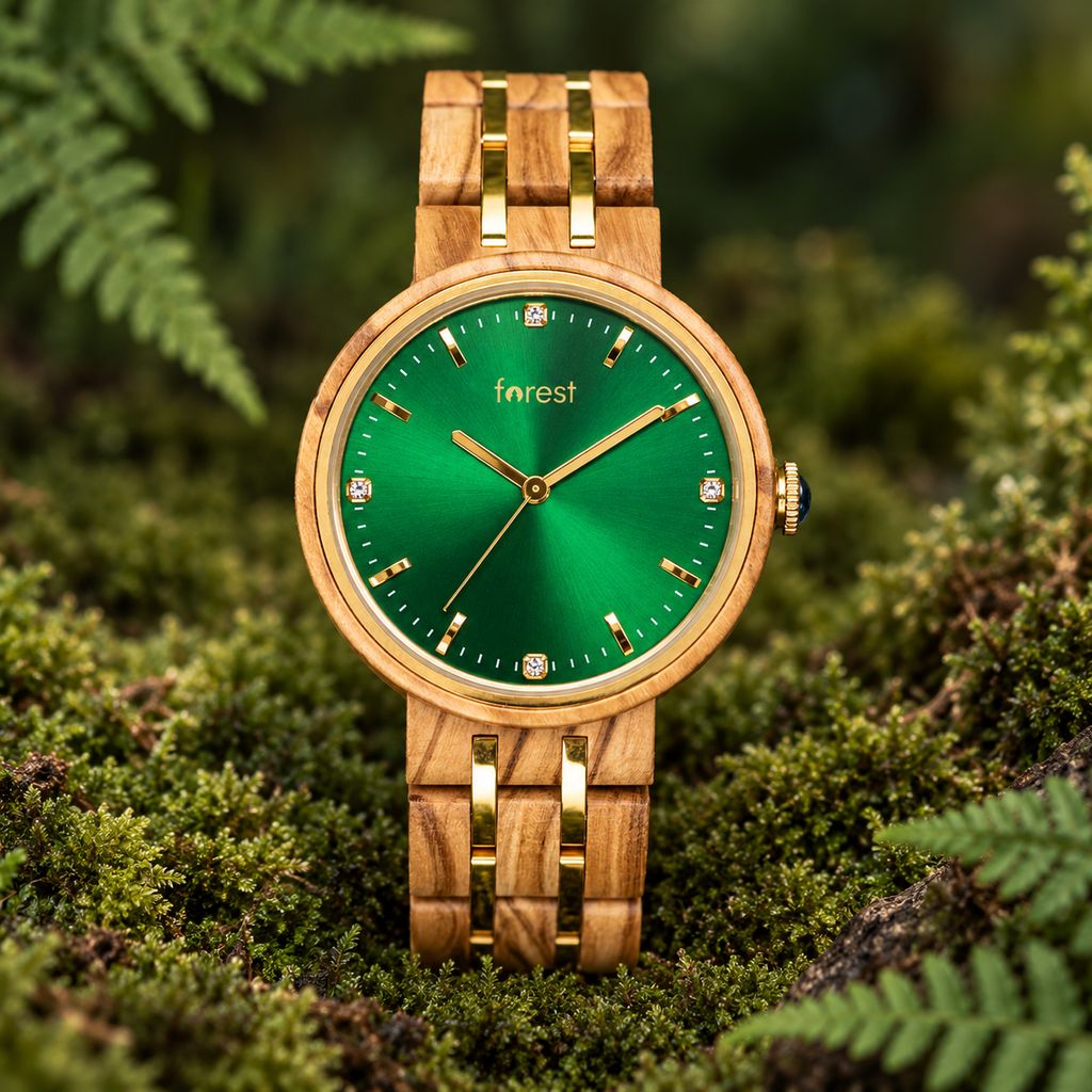 Ivy olivewood watch with an emerald green dial and gold details in a soft green moss setting