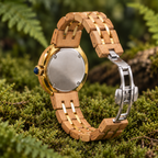 Ivy olivewood watch rear view on moss with silver back, gold rim, recessed navy crown and open silver folding clasp