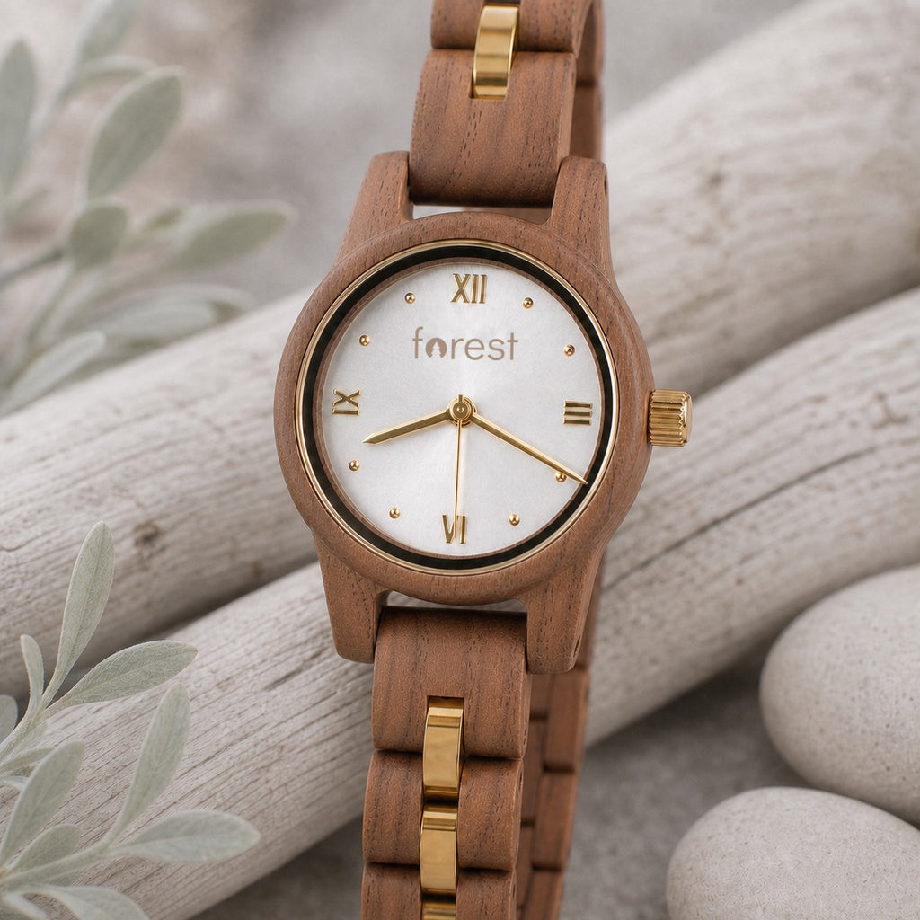 White dial Midnight wooden watch turned slightly, resting on pale driftwood