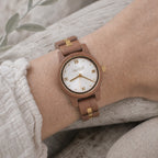 White dial Midnight wooden watch worn on a wrist