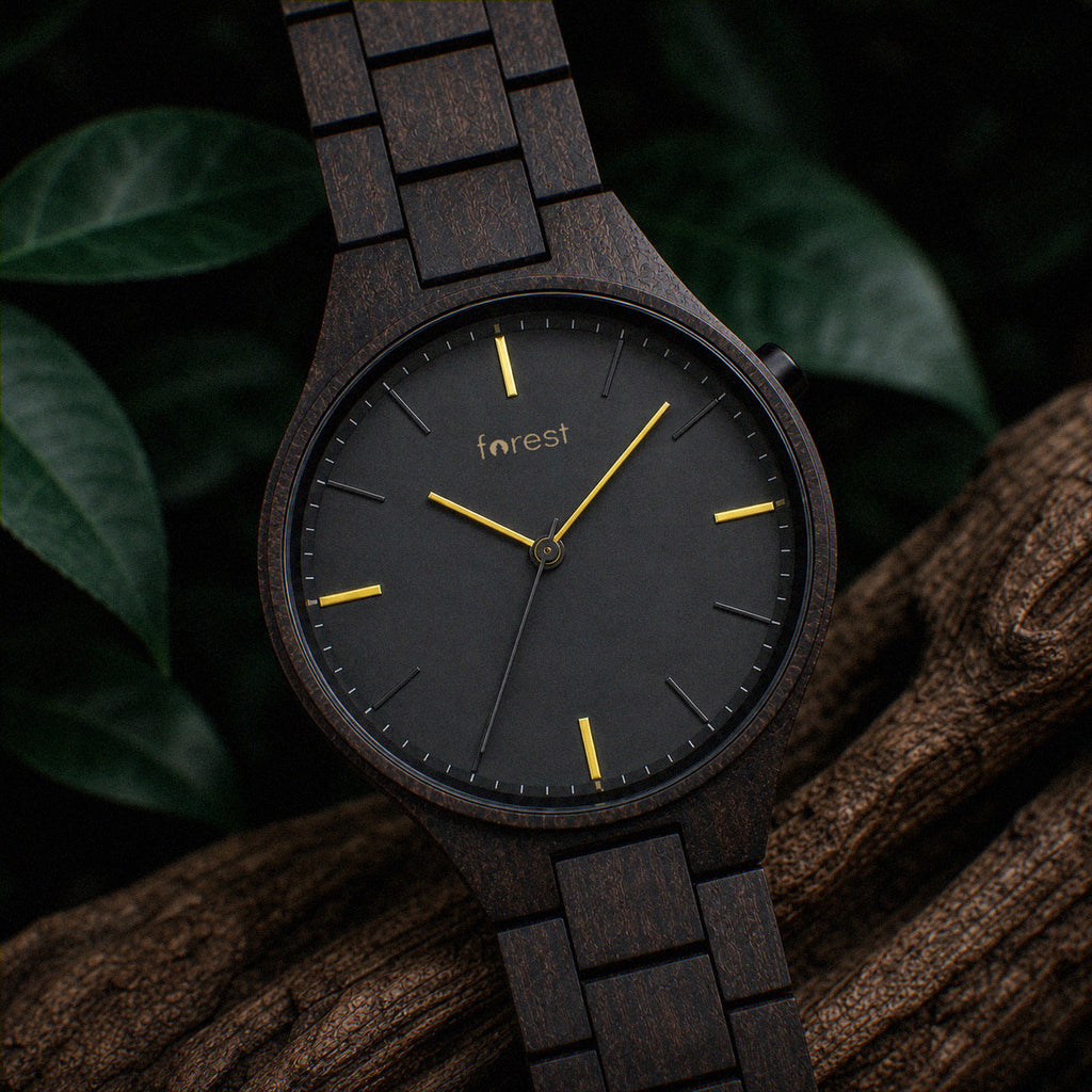 Nightfall wooden watch upright on driftwood among dark foliage