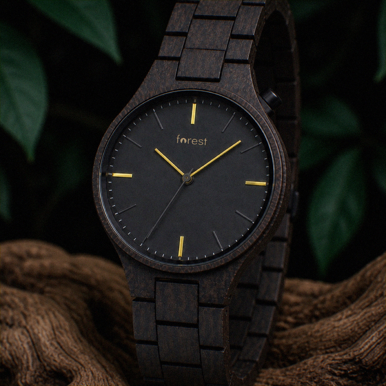 Nightfall wooden watch hanging over a driftwood branch
