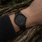 Nightfall wooden watch worn on the wrist outdoors