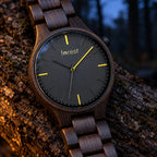 Close-up of the Nightfall dial and ebony case at night