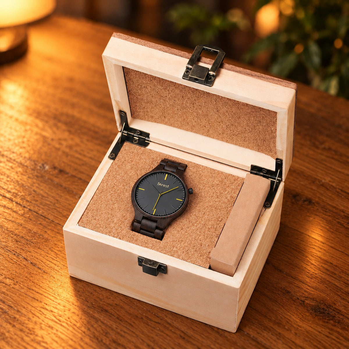 Nightfall ebony watch in its pale wooden gift box on an oak table
