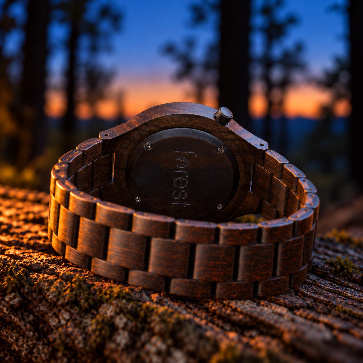 Nightfall watch on its side showing its engraved black back and closed ebony bracelet