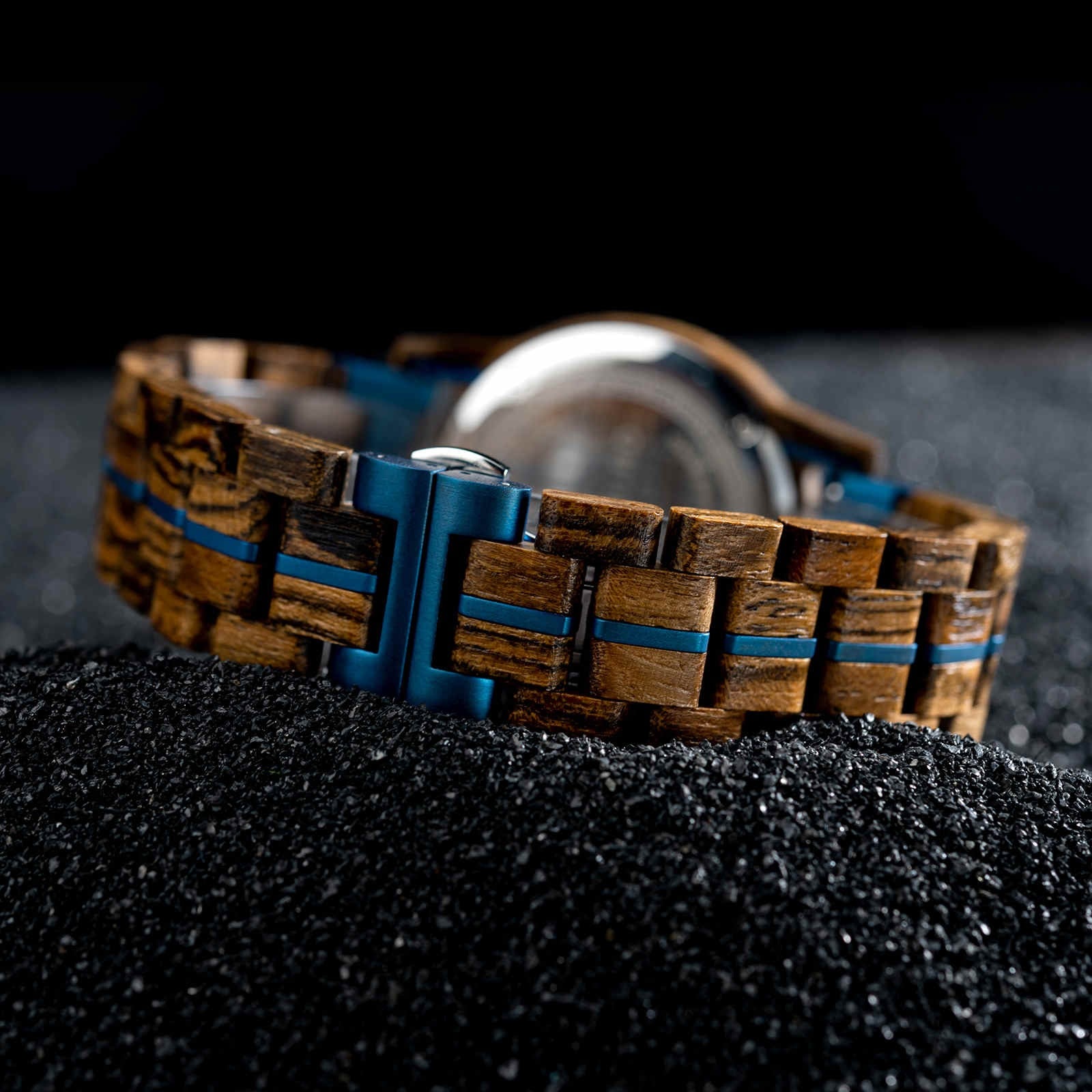 Nightjar wooden watch seen from behind, showing the clasp and blue resin bracelet