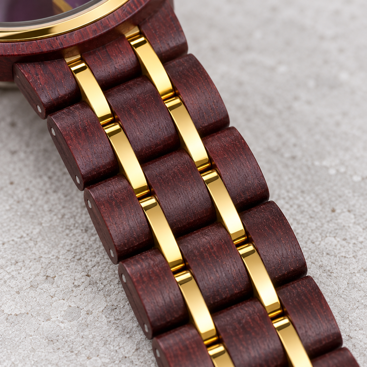 Close view of Royal’s burgundy rosewood bracelet and two narrow gold rails