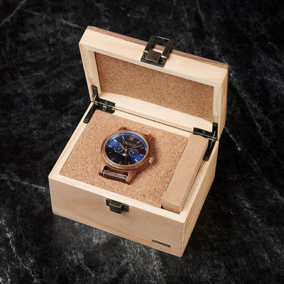 Open wooden box displaying the Windsor watch, emphasizing its premium presentation