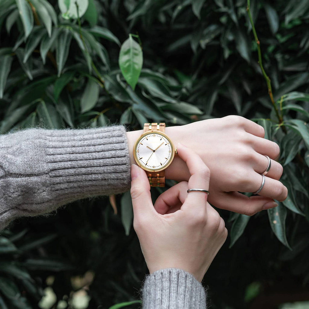 Forest wood watch Victoria on a ladies wrist as she sets the time