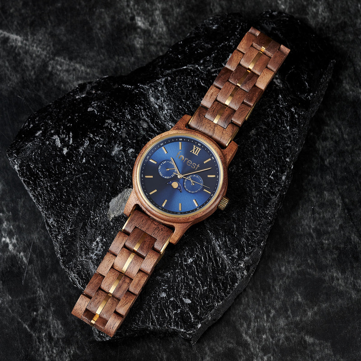 Windsor watch showing its wooden bracelet links and gold-tone details