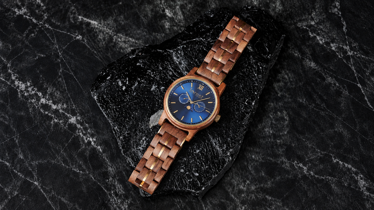 Windsor watch showing its wooden bracelet links and gold-tone details