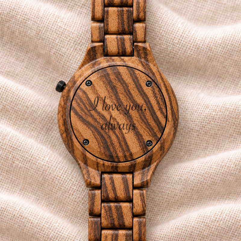 Dusk watch turned over, its zebrawood back engraved with a message